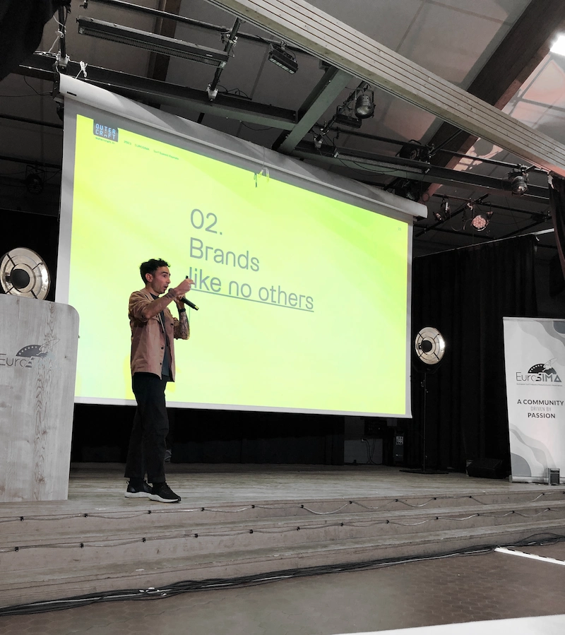 Florian Auger delivering a design and innovation talk at EUROSIMA for the surf industry community.